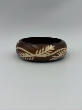 Brown Bracelet with Carved Cream Leaf Motif